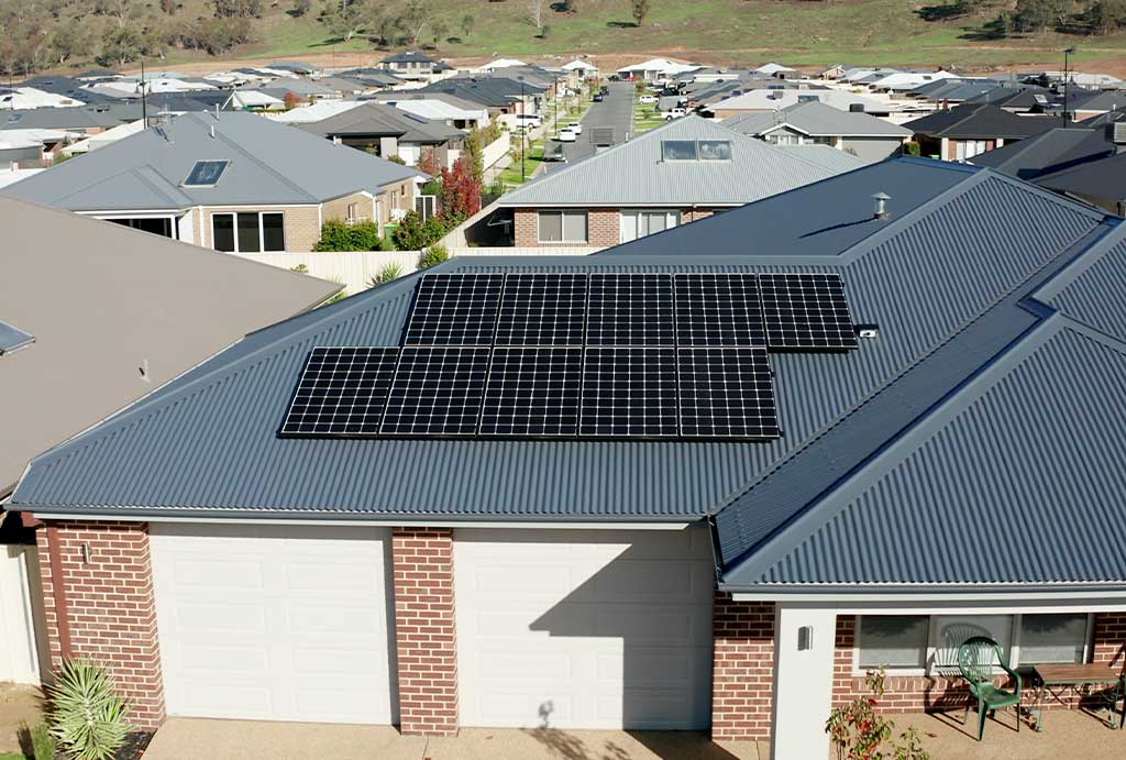 solar panel system installed on a tiled roof in Adelaide with clear blue sky, promoted by Venus Energy for affordable solar solutions.