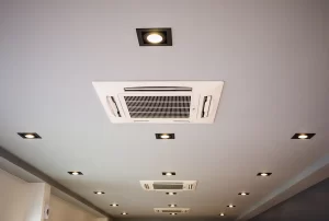 Air Conditioning System Upgrade for Better Performance Technician upgrading an air conditioning system to improve performance and energy efficiency.