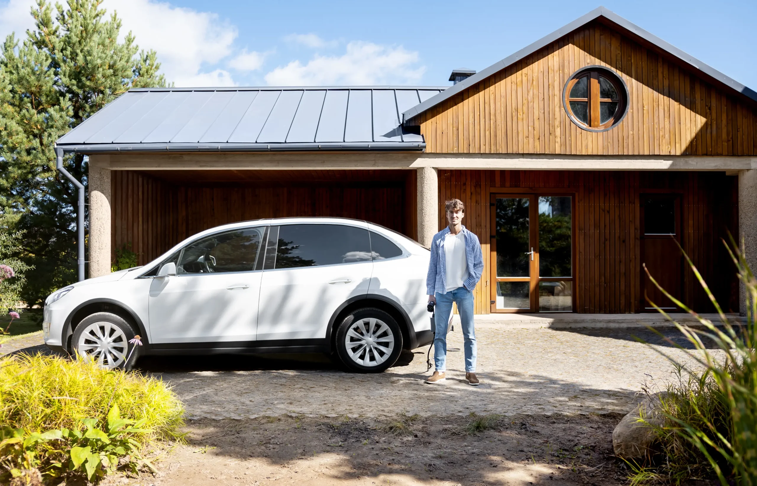 person-taking-care-electric-car-scaled